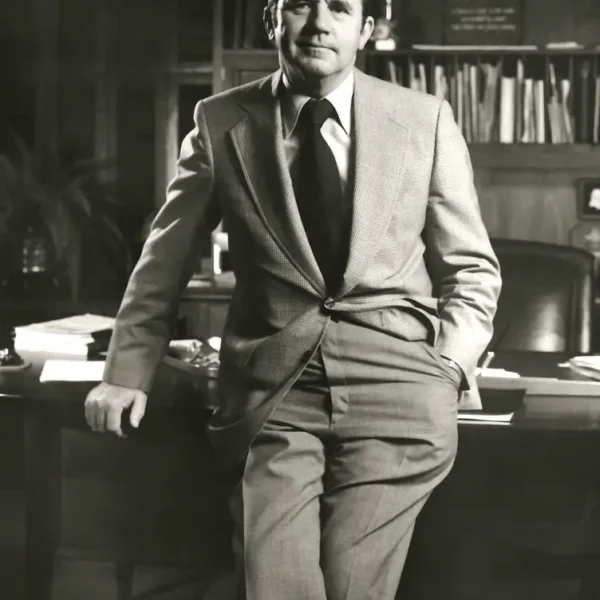 Leslie Lampton Sr. leaning on his office desk